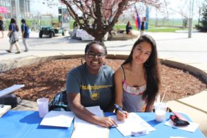 ASUCM members helping San Joaquin County students register to vote.