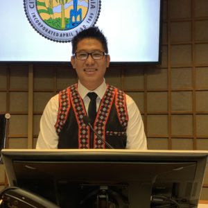 Fue Xiong sits at his seat at City Council